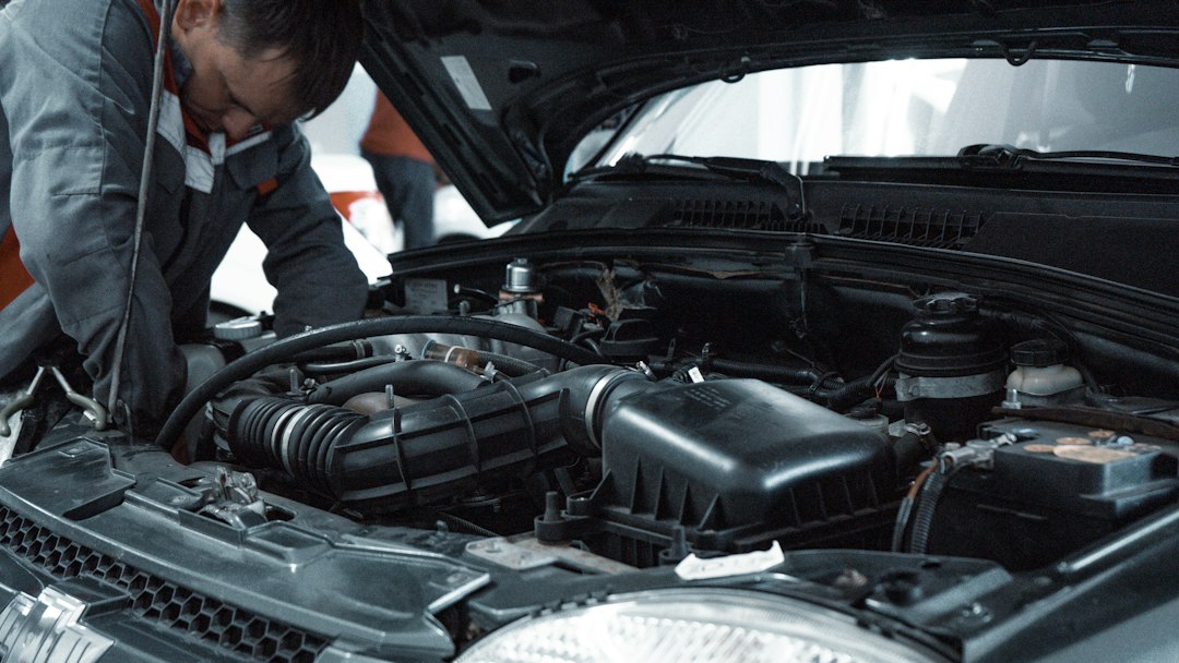 vehicle diagnostic scan tool connected to car for maintenance check