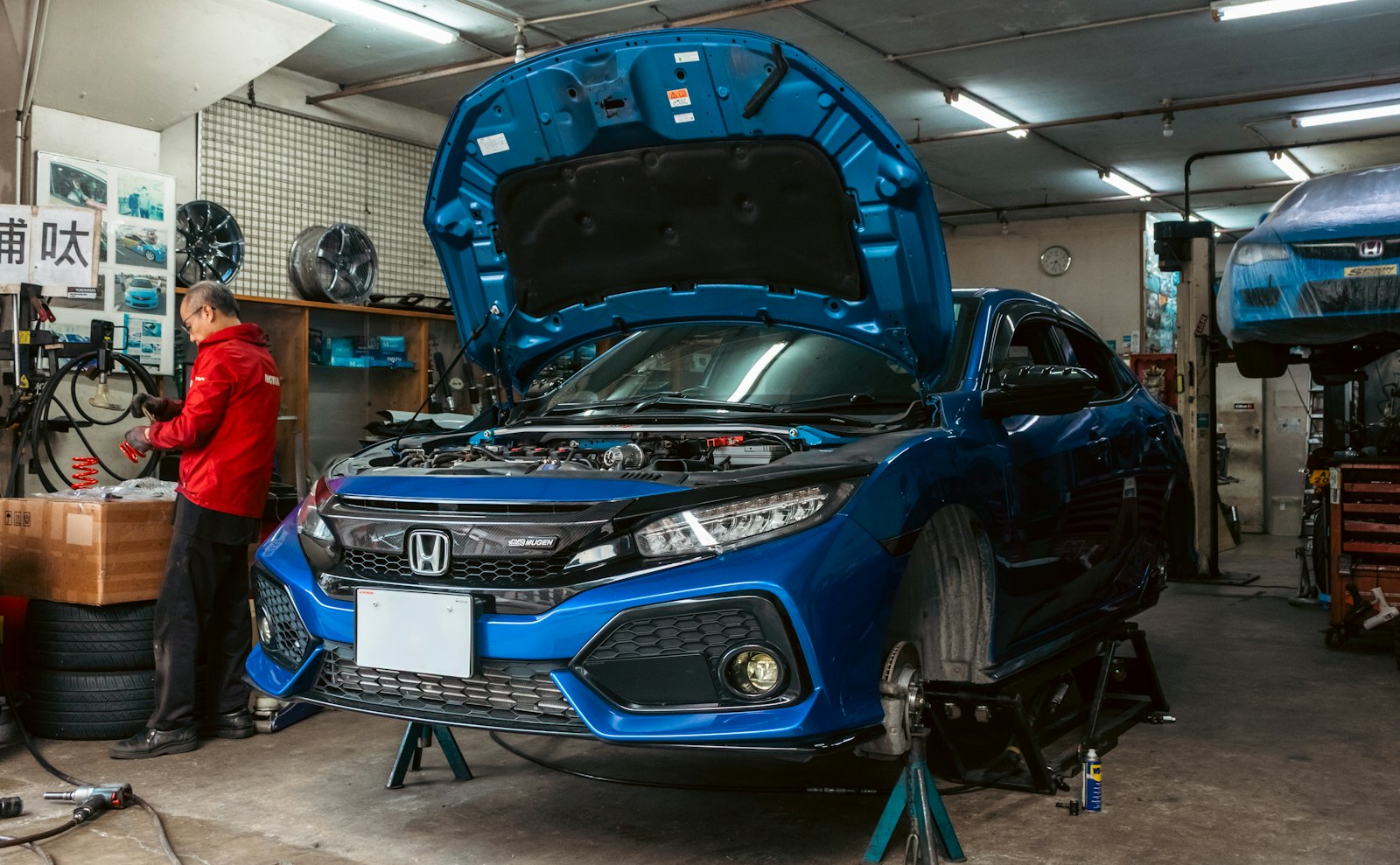 Professional automotive service facility with detailed vehicle care and organized tools